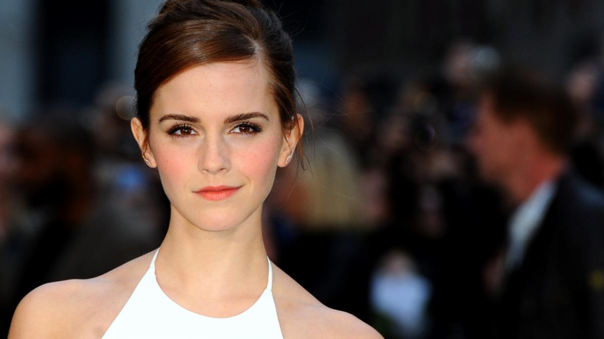 Emma Watson gracefully posing in a flowing white dress, exuding elegance and poise (1920x1080)