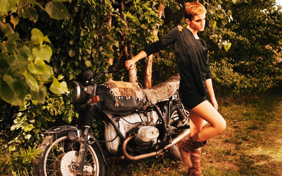 Emma Watson with a short haircut, standing confidently next to a sleek motorbike (1920x1200)