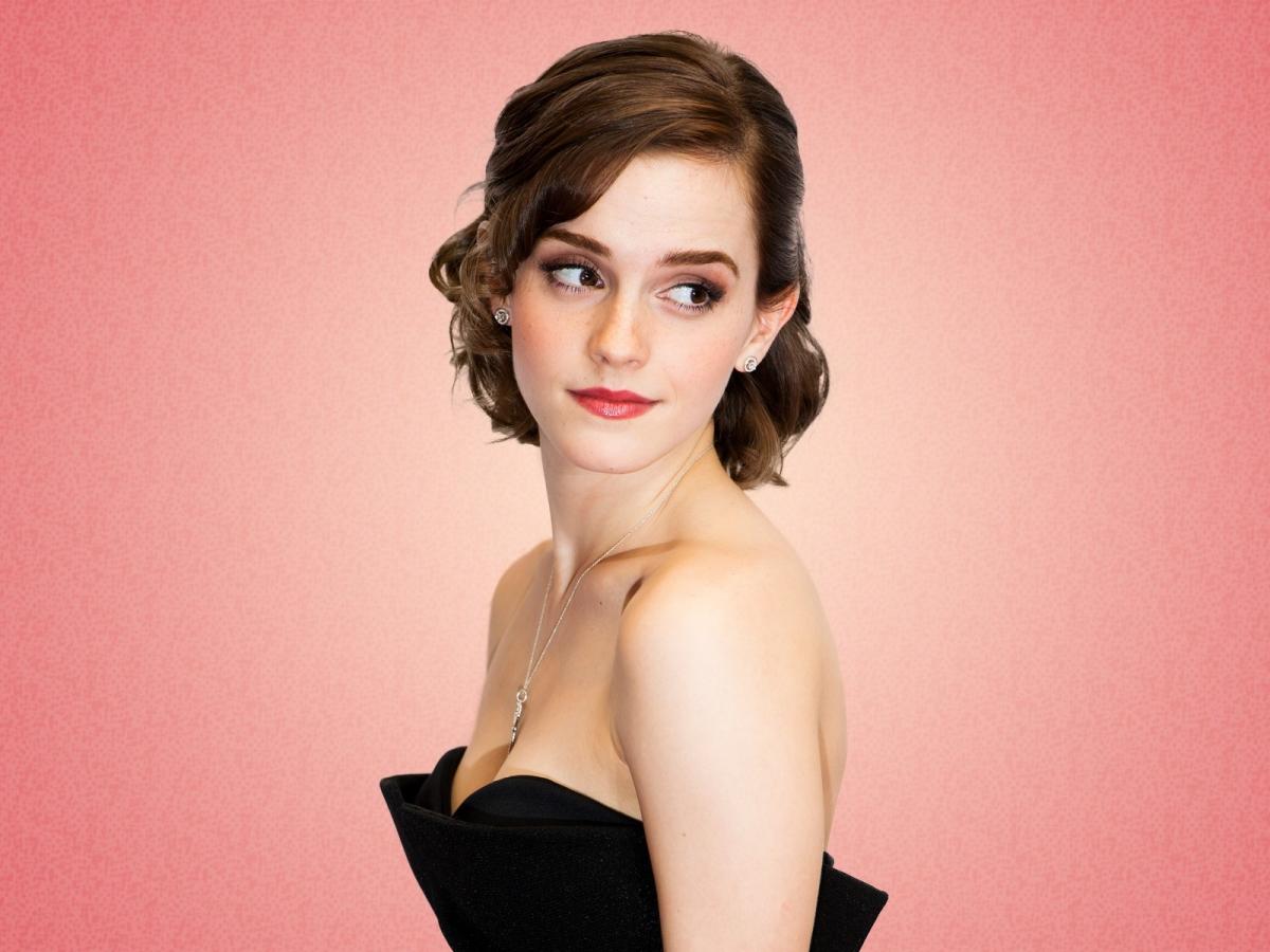 Emma Watson in a sophisticated black dress, gazing thoughtfully to the side (1600x1200)
