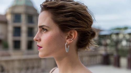 Emma Watson in profile, showcasing her elegant features and poised demeanor (1920x1080)