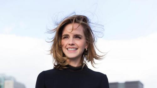 Emma Watson with wind-ruffled hair, exuding natural beauty and elegance (1920x1080)